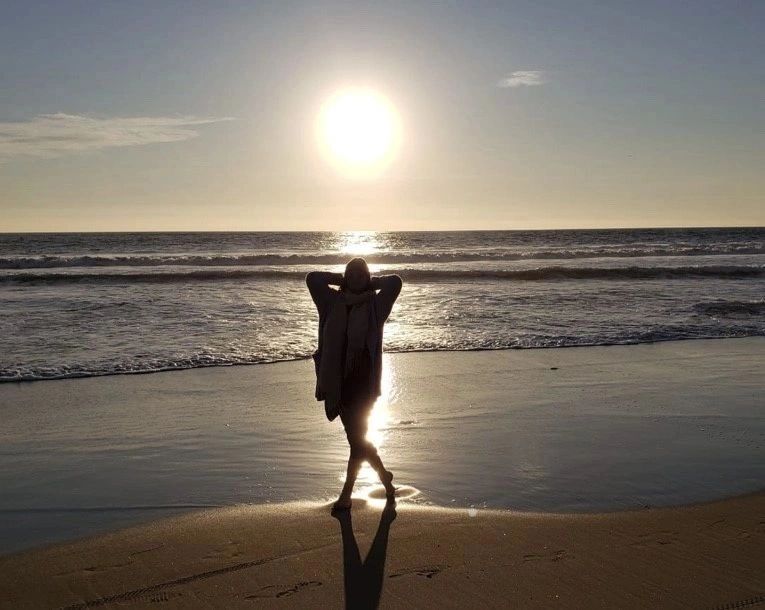 Silhouette on beach at golden hour